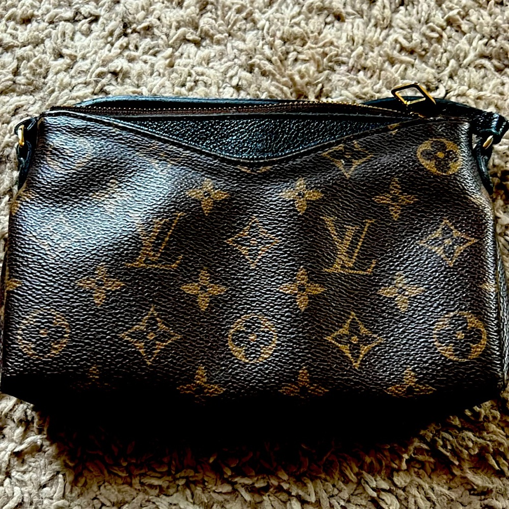 Louis Vuitton employee pouch.